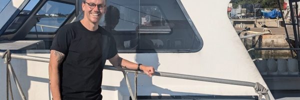 Stuart Robertson by a dive boat